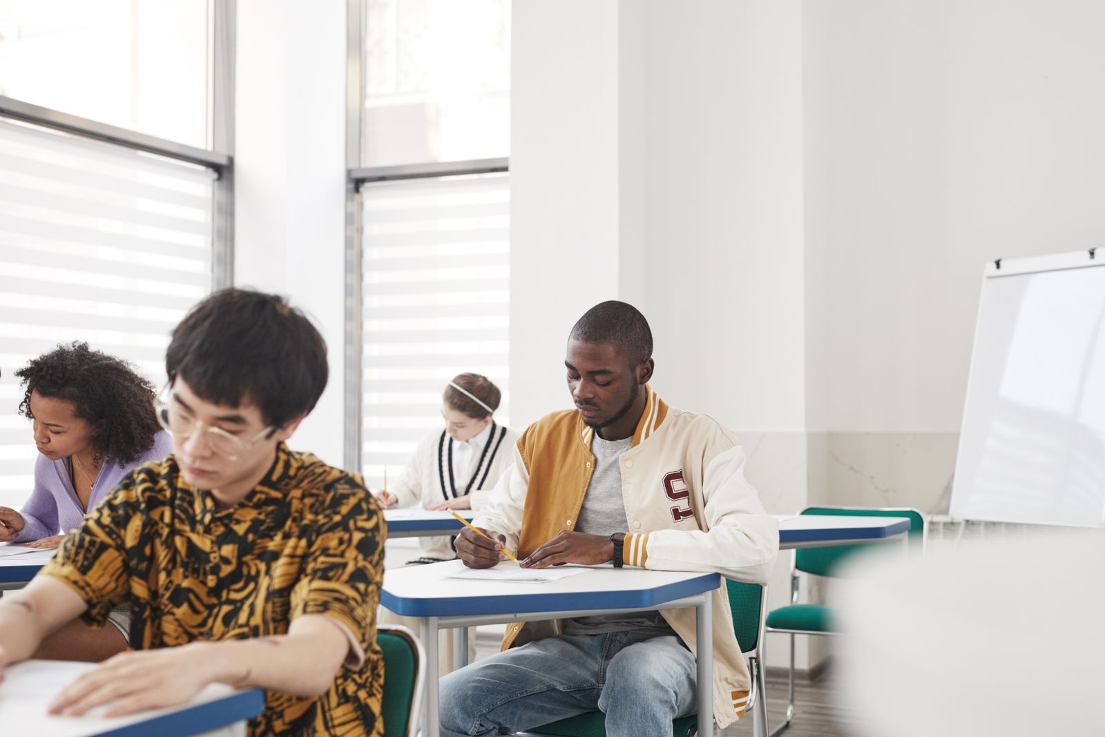 University students taking an exam in a classroom